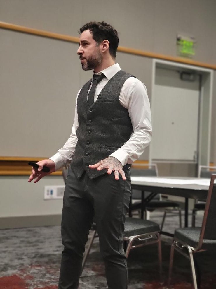 Zach Stone speaking during a conference workshop